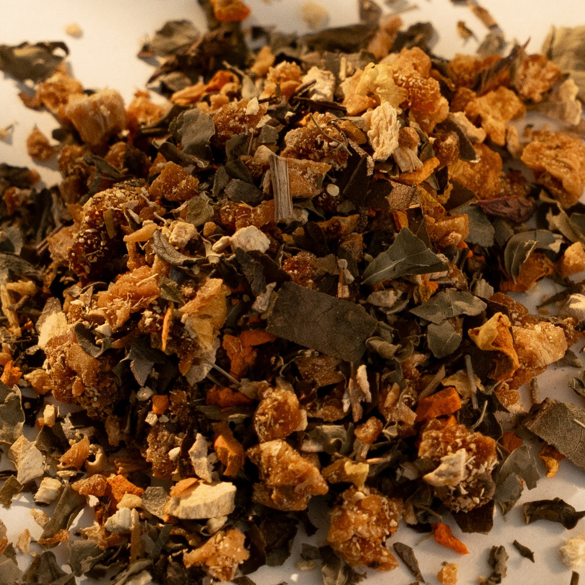 Rooted loose leaf up close, with dried pineapple among the leaves